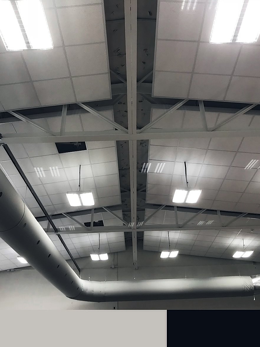 Acoustical ceiling clouds in an industrial space