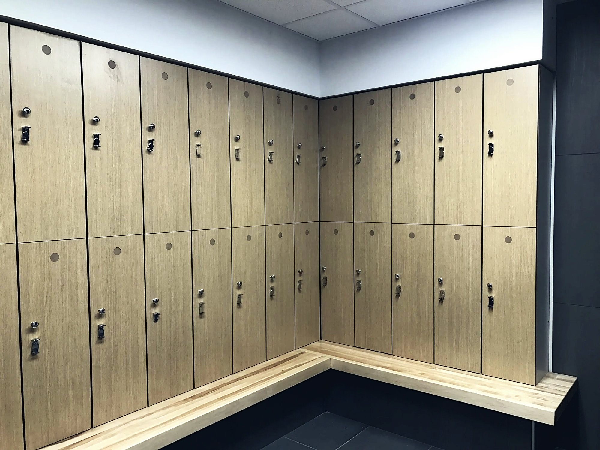 Wood veneer lockers and bench installed by RELCO